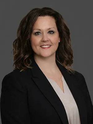 Ashley Stites, APRN, CNP, wearing a professional dark blazer.