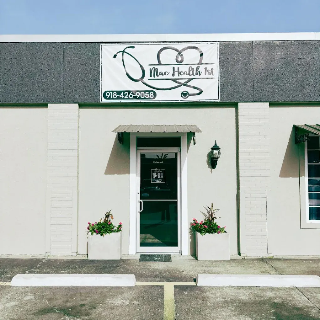 Exterior of a primary care clinic featuring a banner and phone number.